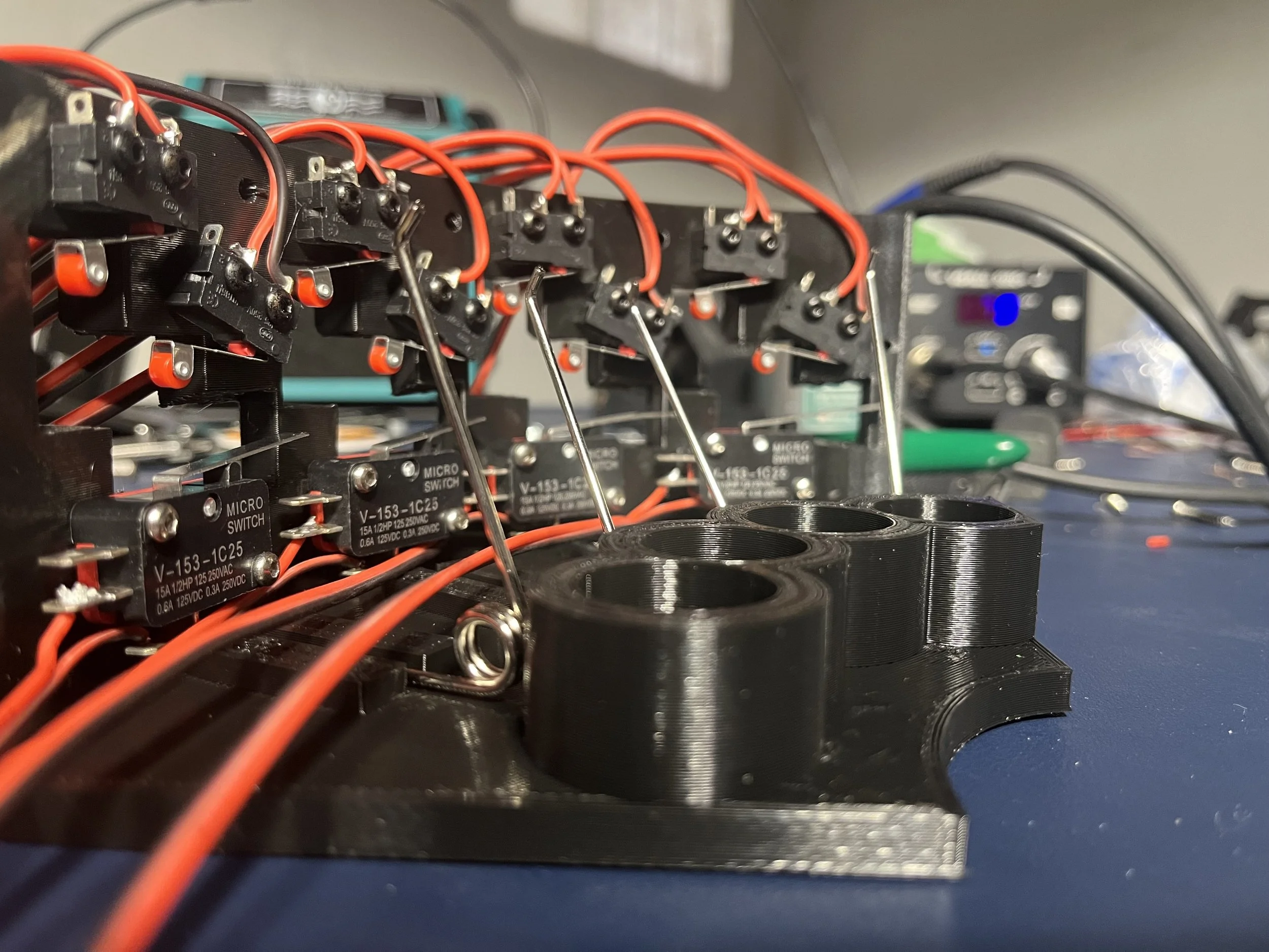 Close-up of microswitches and wiring used in the OpenPedal system to detect flat, natural, and sharp positions for each note.